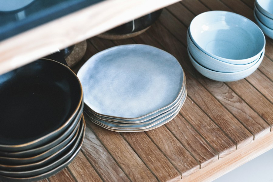 Hand-finished ceramic bowls on a wood shelf